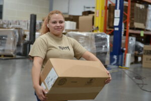 Warehouse staff carrying a box